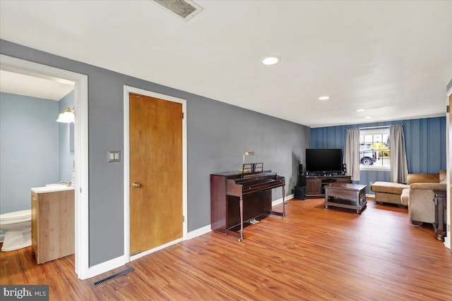 living room featuring sink and wood-type flooring