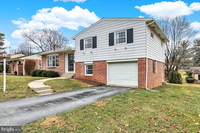 tri-level home with a garage and a front lawn