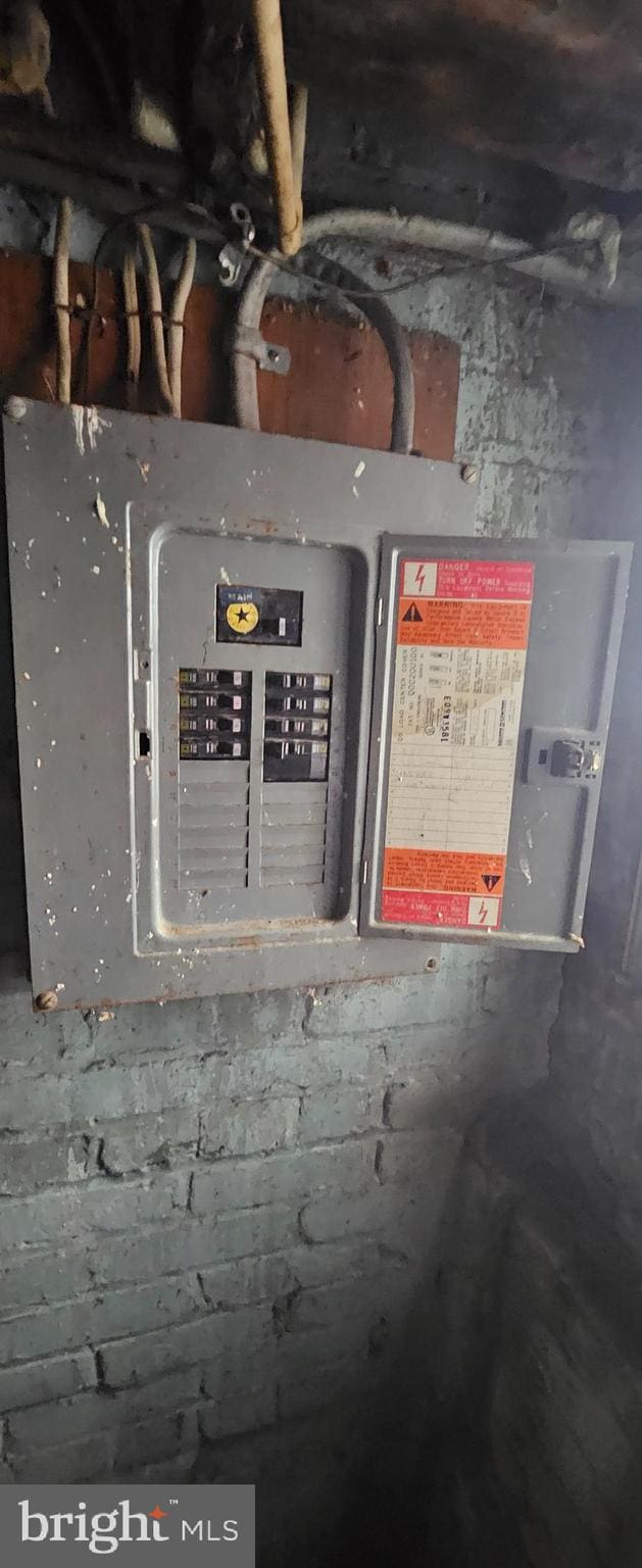 utility room featuring electric panel