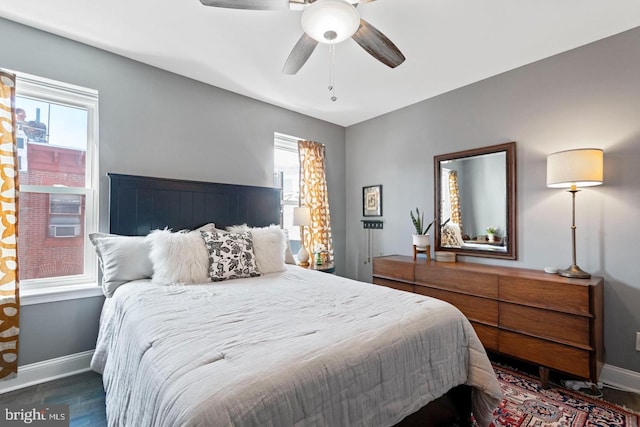 bedroom featuring dark hardwood / wood-style flooring and ceiling fan