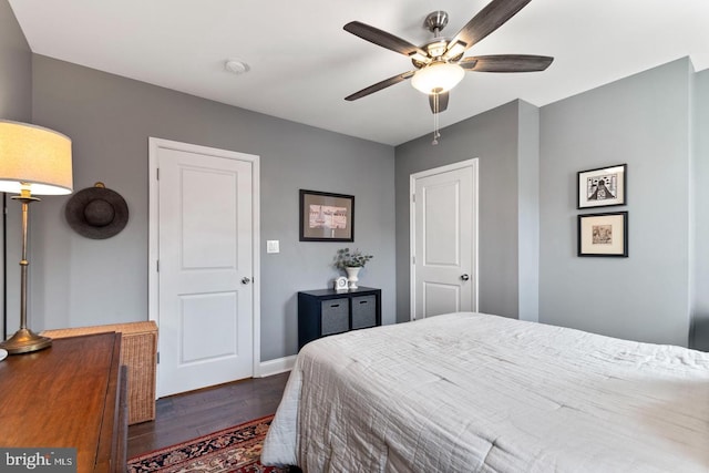 bedroom featuring ceiling fan and dark hardwood / wood-style flooring