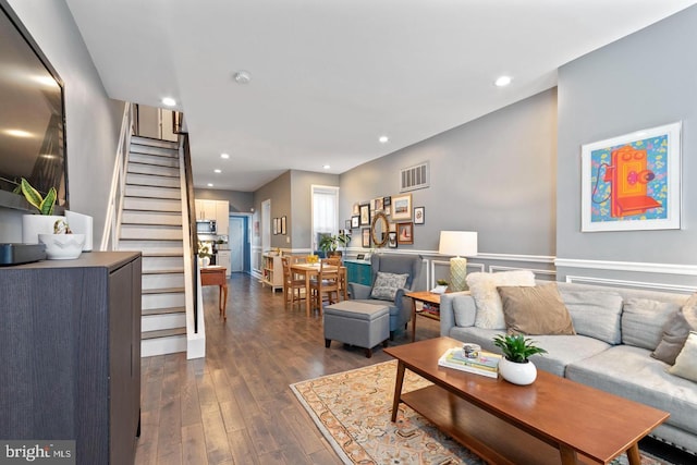 living room featuring dark wood-type flooring