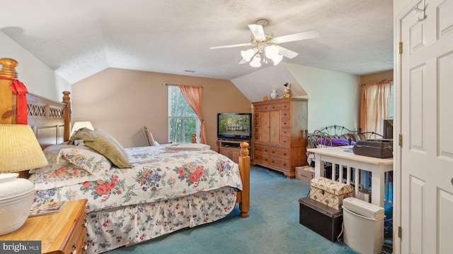 bedroom featuring ceiling fan, vaulted ceiling, carpet, and a textured ceiling