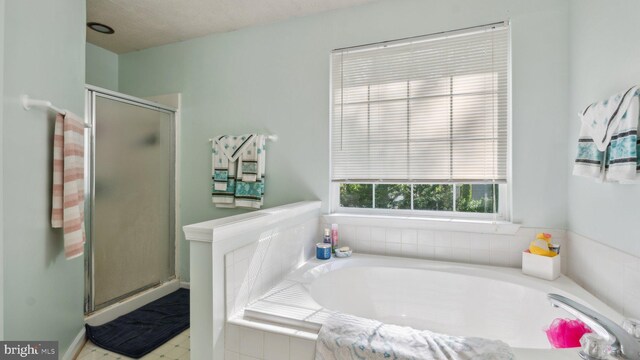 bathroom with independent shower and bath