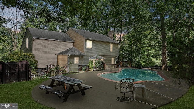 view of swimming pool featuring a patio area