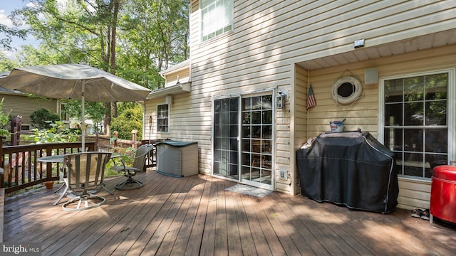 wooden terrace featuring grilling area