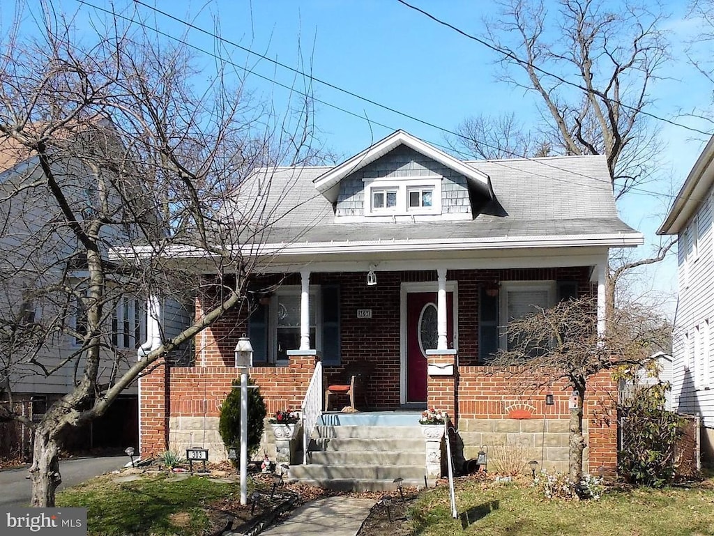 bungalow-style home featuring covered porch