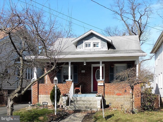 bungalow-style home featuring covered porch