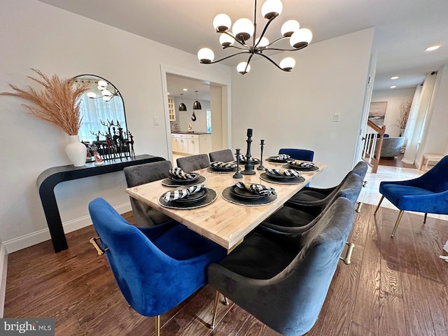 dining room featuring a notable chandelier and wood-type flooring