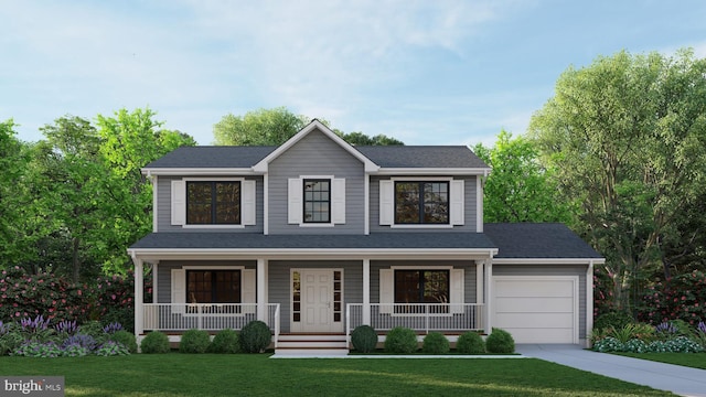 view of front of property with a porch, a front yard, and a garage