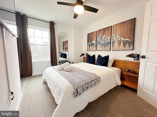 carpeted bedroom with ceiling fan