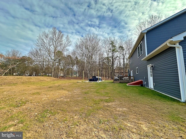 view of yard featuring a wooden deck