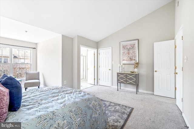 carpeted bedroom with vaulted ceiling