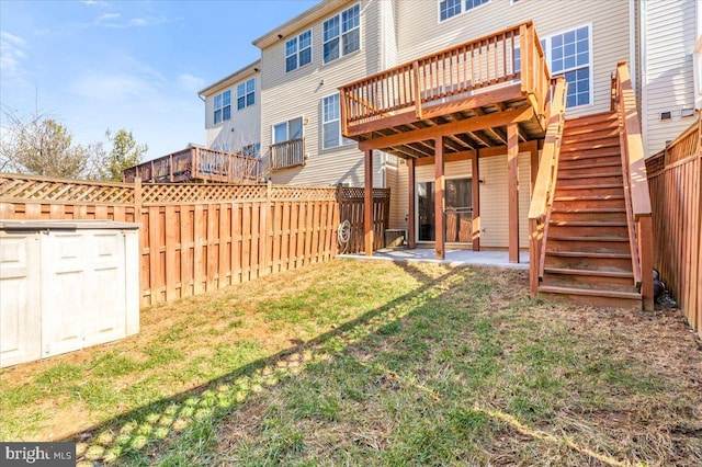 view of yard with a storage unit and a deck