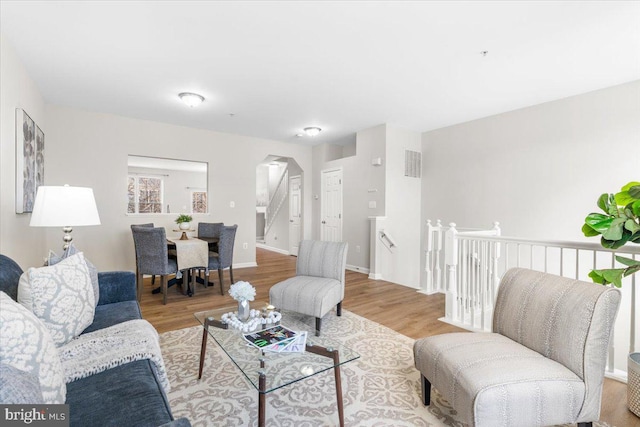 living room with light hardwood / wood-style flooring