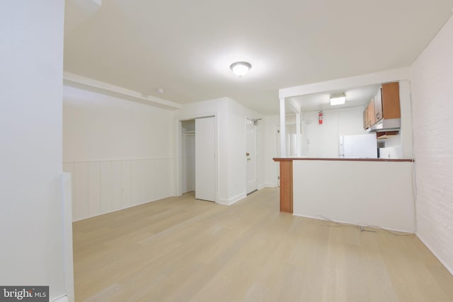 unfurnished room featuring light wood-type flooring