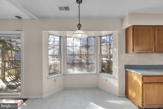 unfurnished dining area with a healthy amount of sunlight