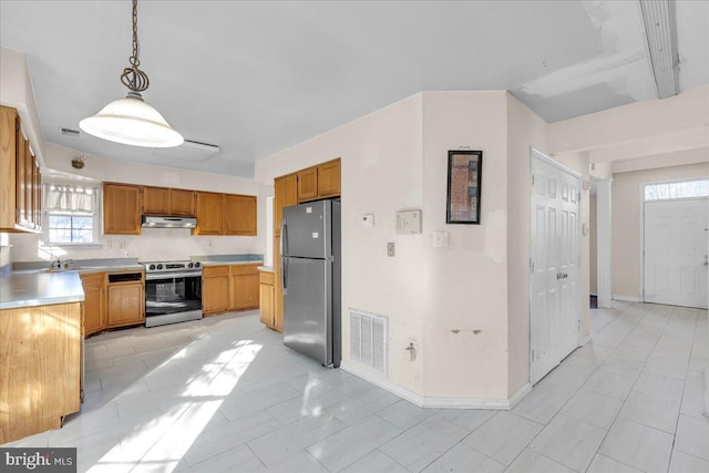 kitchen featuring hanging light fixtures and stainless steel appliances