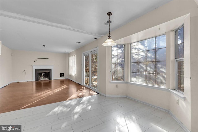 unfurnished living room with light hardwood / wood-style flooring