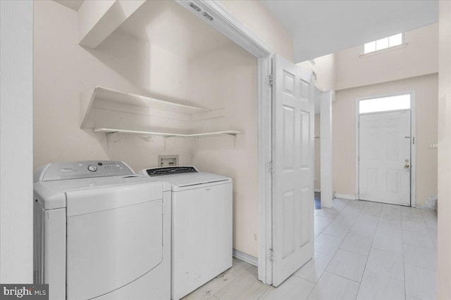 laundry room with independent washer and dryer