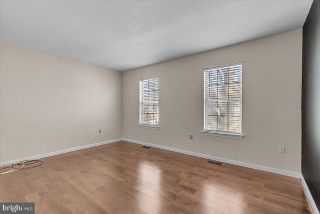 empty room with wood-type flooring