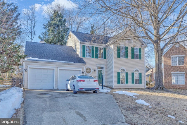 view of front of property with a garage