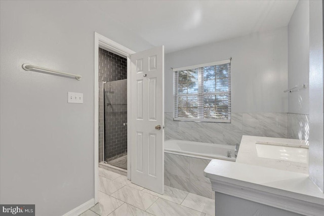 bathroom featuring vanity and independent shower and bath