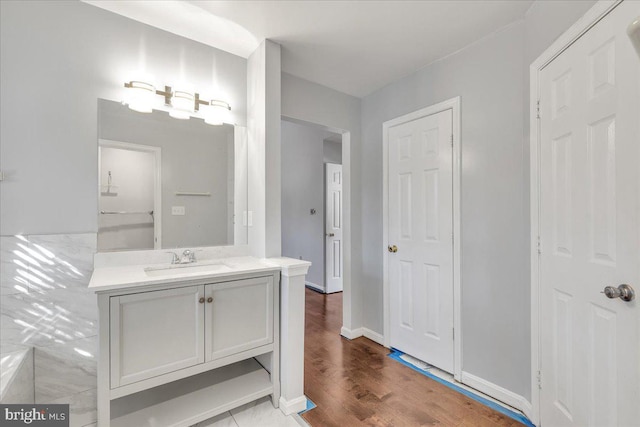 bathroom featuring vanity and wood-type flooring