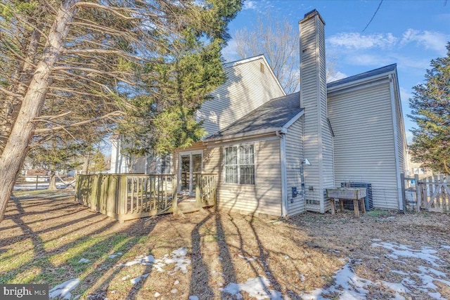 back of house featuring a deck