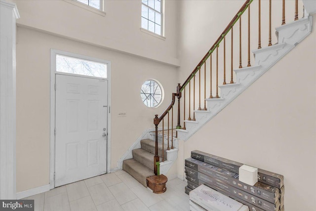 foyer entrance with a high ceiling