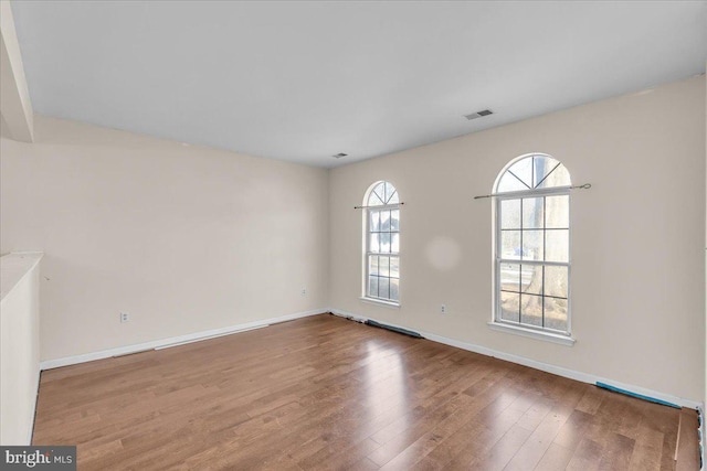 unfurnished room featuring wood-type flooring