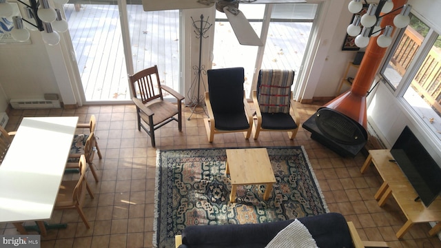 living room with a wealth of natural light and tile patterned floors