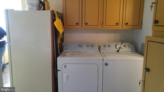 clothes washing area with separate washer and dryer