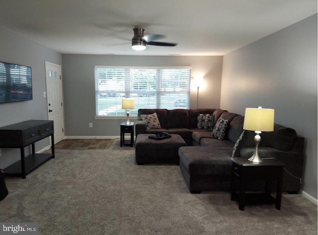 living room with ceiling fan and carpet