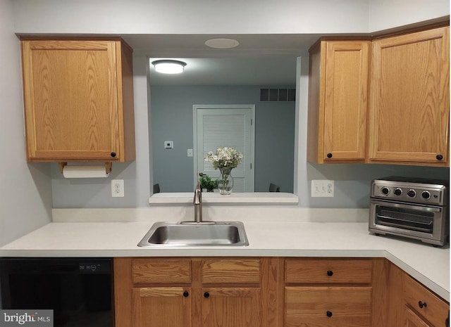 kitchen featuring sink and dishwasher