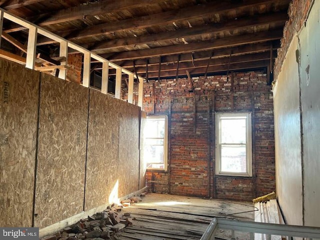 misc room with plenty of natural light, wood ceiling, and beam ceiling