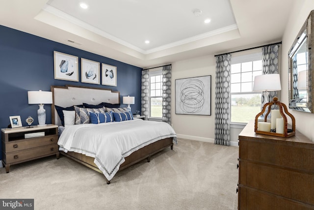 carpeted bedroom featuring a raised ceiling, crown molding, and multiple windows