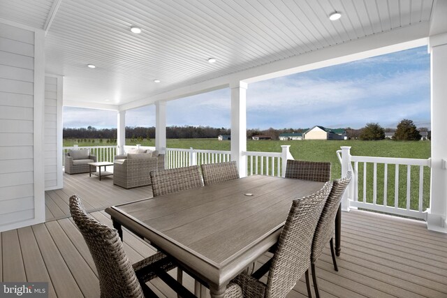 deck featuring a yard and an outdoor living space