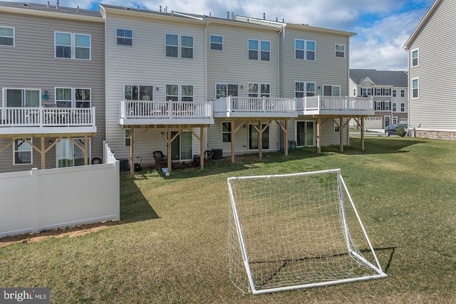 rear view of house featuring central AC unit