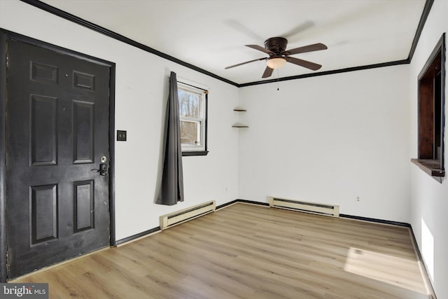 entrance foyer featuring baseboard heating, light wood-type flooring, ceiling fan, and crown molding