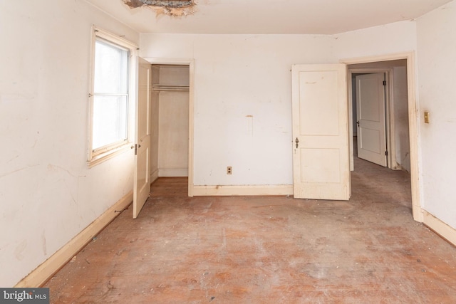 unfurnished bedroom with a closet