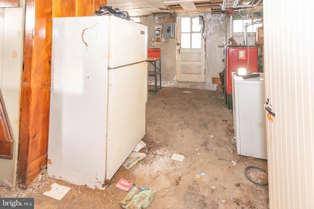 interior space with electric panel, white refrigerator, and washer / dryer