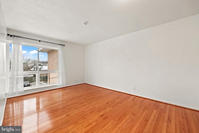 spare room featuring light hardwood / wood-style floors