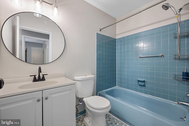 full bathroom with vanity, tiled shower / bath combo, tile patterned floors, and toilet