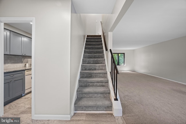 staircase with carpet