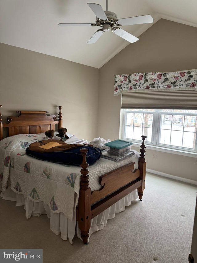 bedroom with light carpet, ceiling fan, and lofted ceiling