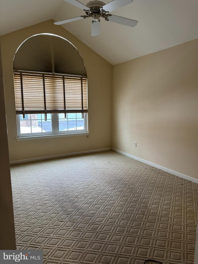 unfurnished room with ceiling fan and lofted ceiling