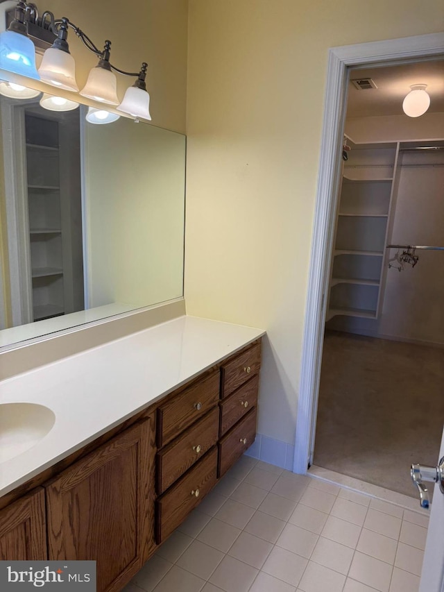 bathroom with tile patterned flooring and vanity