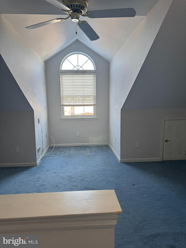 additional living space with ceiling fan, carpet floors, and vaulted ceiling