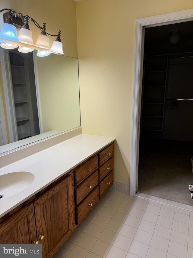 bathroom featuring vanity and tile patterned flooring